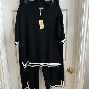 Elegant Black Lounge Set with White Trim